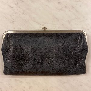 Hobo Lauren wallet with black embossed detail.